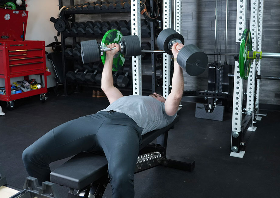 coop-doing-bench-press-with-snode-dumbbells