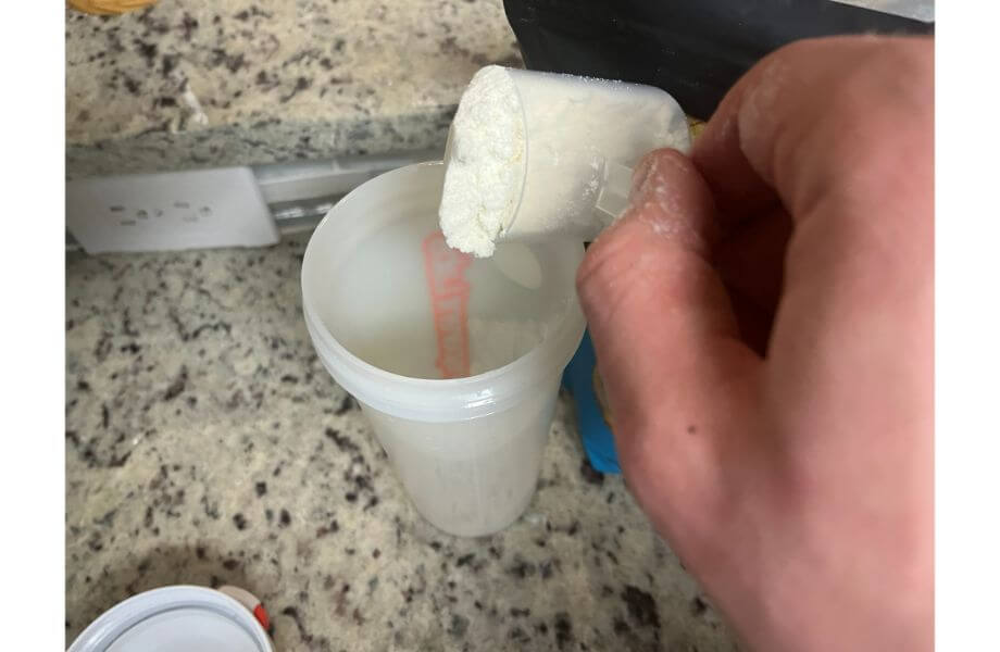 legion whey protein powder scoop